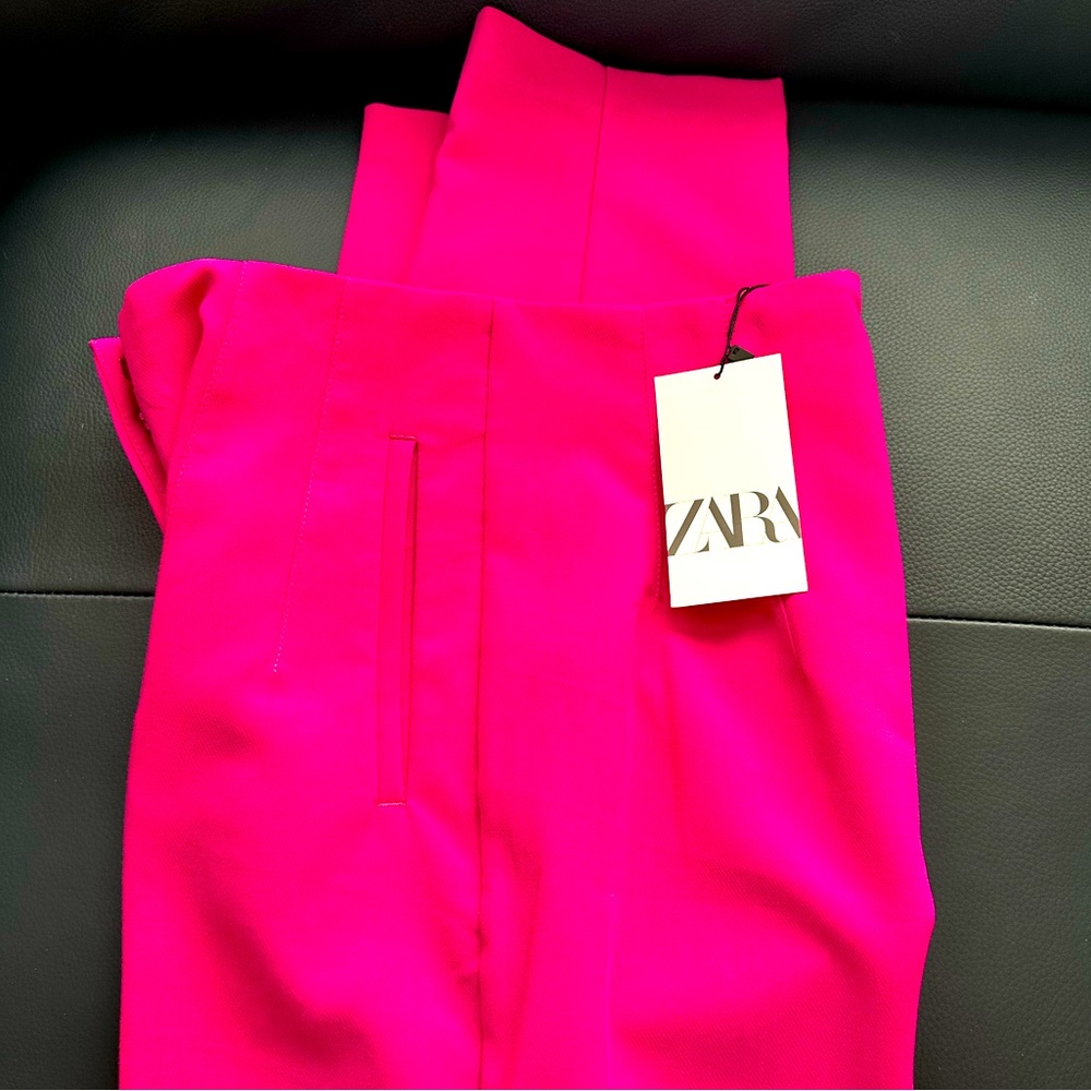 Brand new high waistline Side pockets, front zipper, v line on the back.
